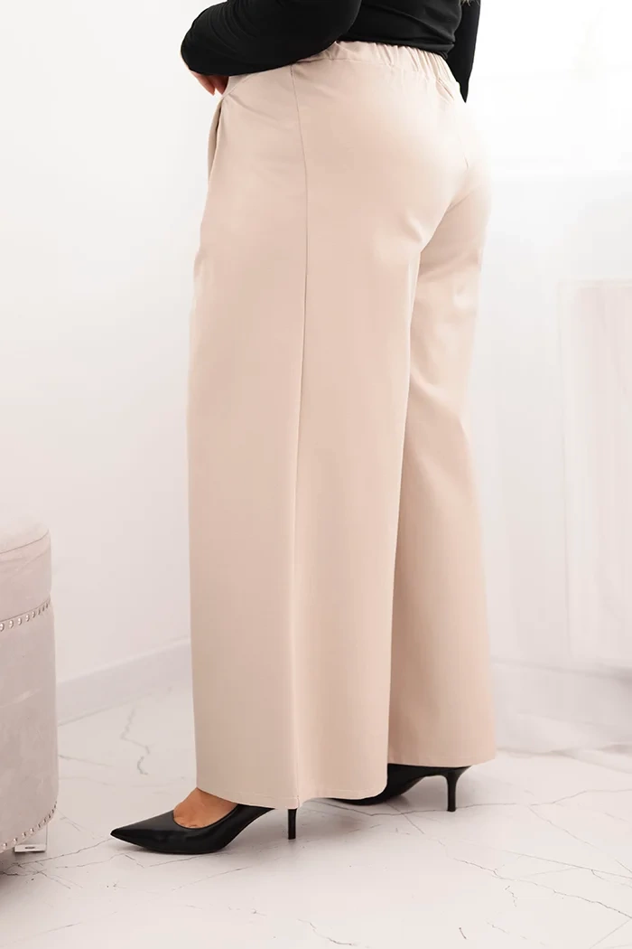 Spodnie damskie Plus Size z szerokimi nogawkami i plisowaniem beżowe 3 Spodnie damskie Plus Size z szerokimi nogawkami i plisowaniem beżowe - obrazek 3